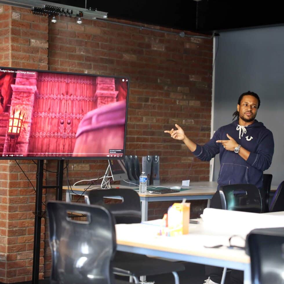 MetStudios student giving small talk in front of a screen