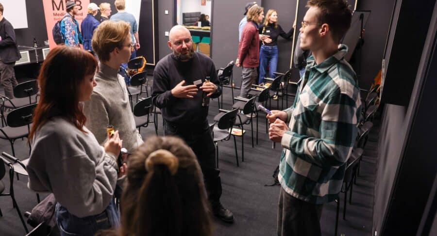 MetStudios students at class talking with lecturers
