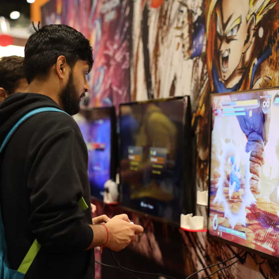 ComicCon gamer using console
