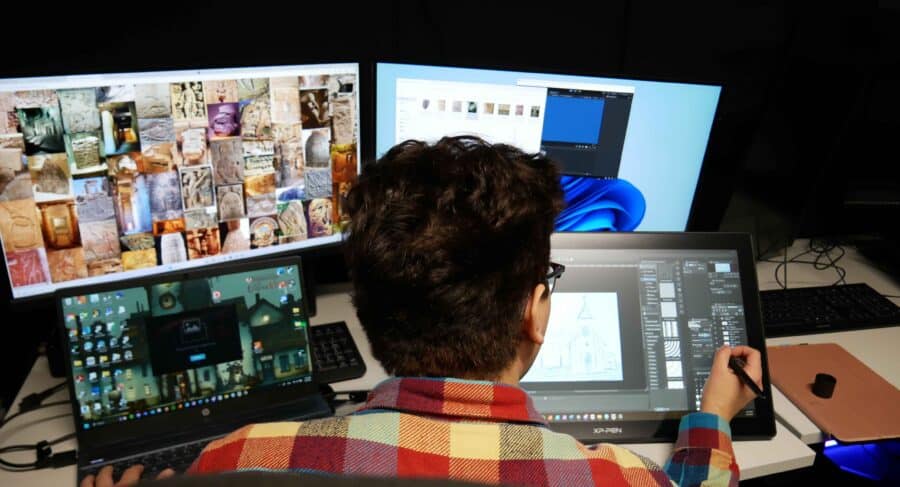 Closeup of MetStudios student working at computer