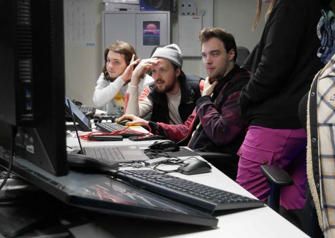 MetStudios Brighton postgrad students working at a computer together