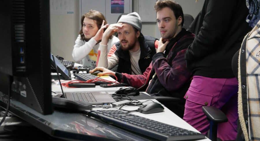 MetStudios Brighton postgrad students working at a computer together