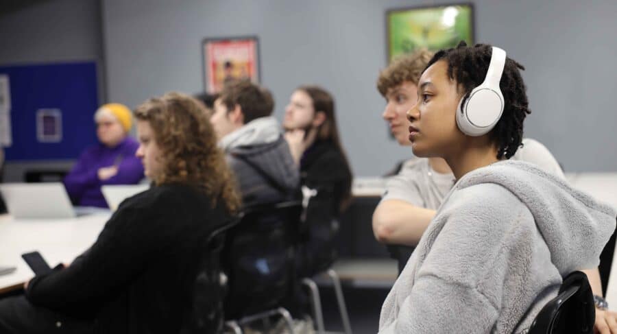 MetStudios Brighton students, seated at a class
