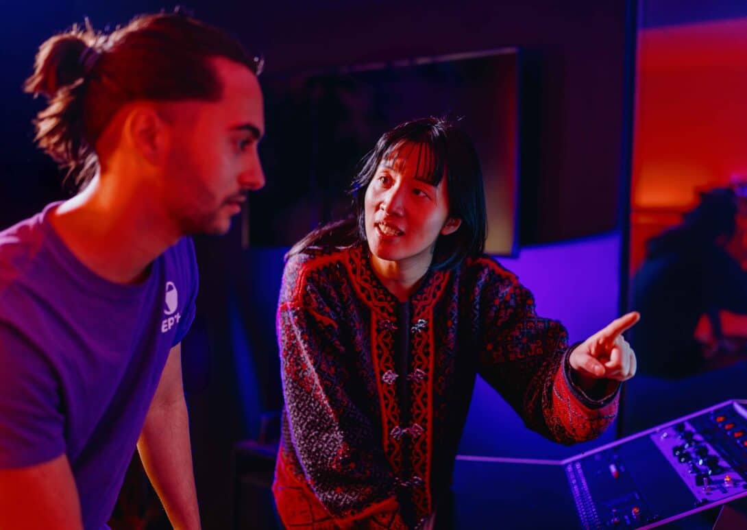 MetStudios game design student talking with lecturer