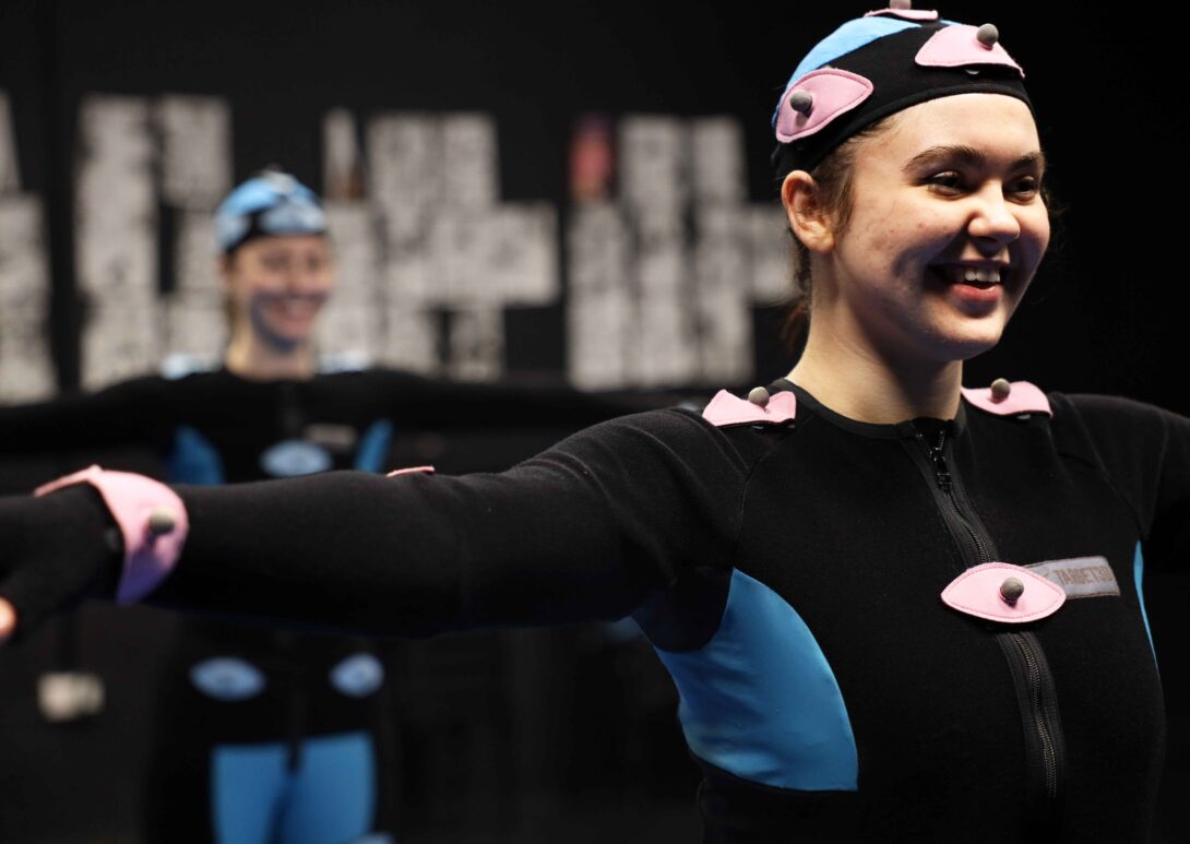 MetStudios student smiling while wearing motion capture suit