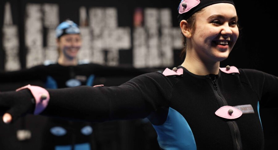 MetStudios student smiling while wearing motion capture suit