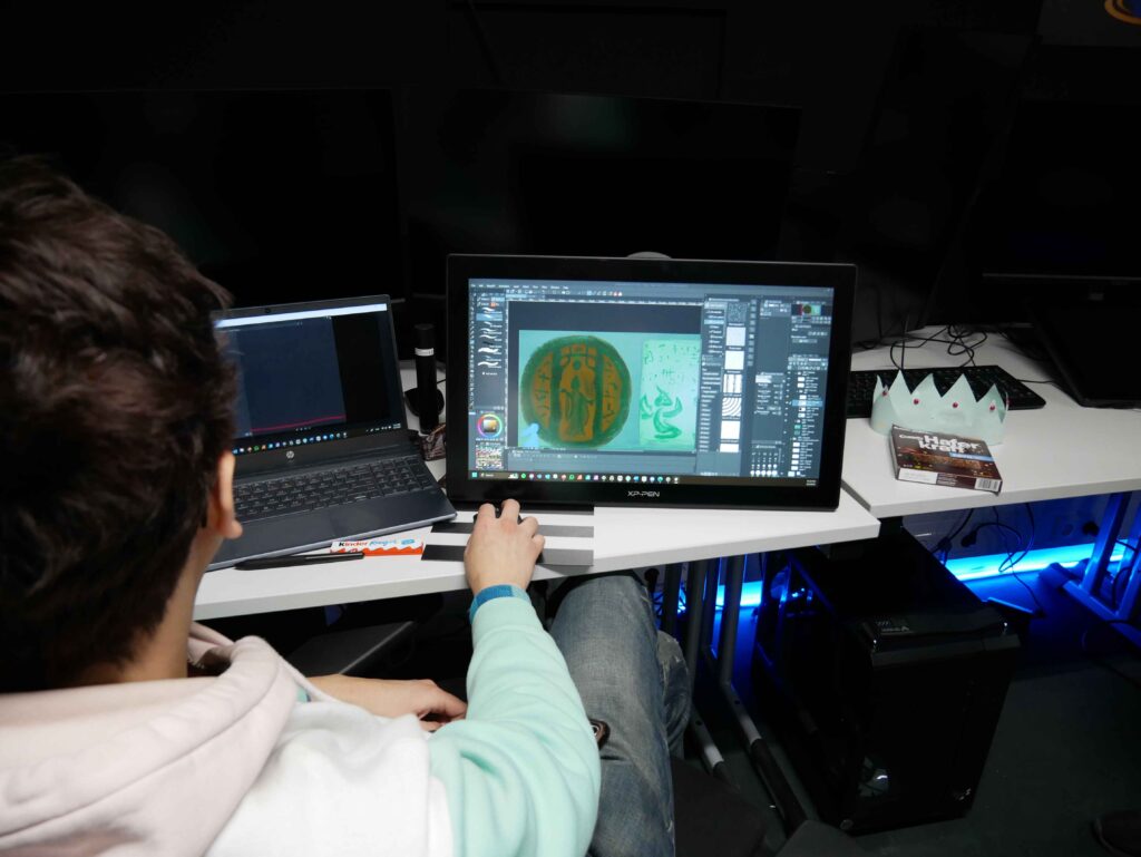 MetStudios student working on a game while at a desk