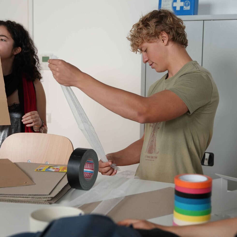 MetStudios students working at a workshop together with materials