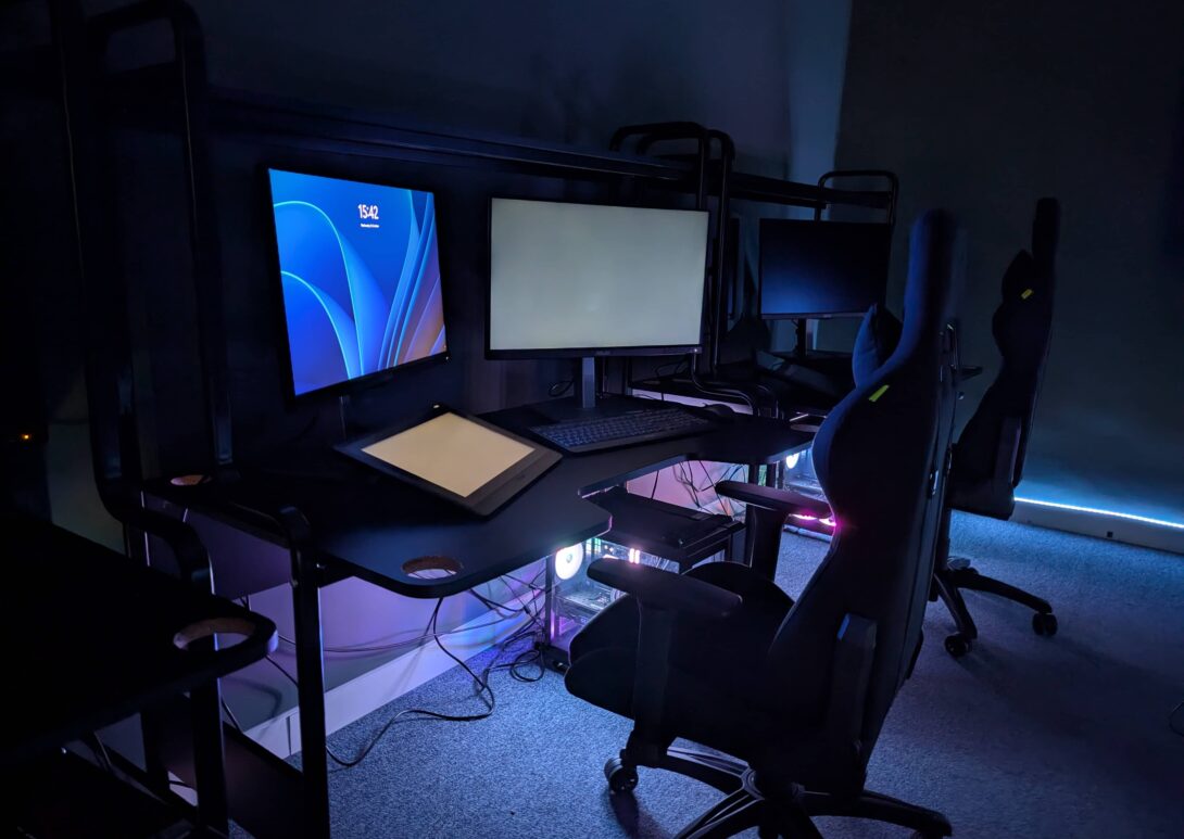 a pc setup in a room with LED lighting