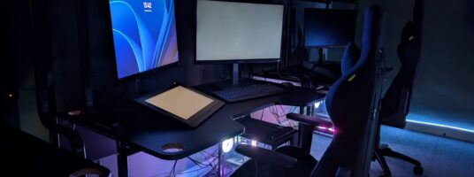 a pc setup in a room with LED lighting