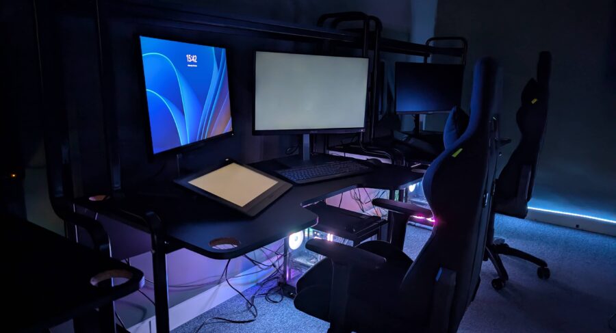 a pc setup in a room with LED lighting